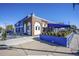 Exterior shot of Colorado 38, showing its blue and brick facade and outdoor seating at 10151 W 38Th Ave, Wheat Ridge, CO 80033