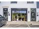 Charming GetRight's storefront with plants displayed and marked reserved parking space at 10151 W 38Th Ave, Wheat Ridge, CO 80033