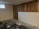 Unfinished basement features insulation and a window at 405 Dogwood Ave, Brighton, CO 80601
