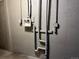 Basement wall with white pipes and electrical connections at 405 Dogwood Ave, Brighton, CO 80601
