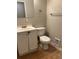 Bathroom with white toilet and vanity at 405 Dogwood Ave, Brighton, CO 80601