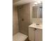 Bathroom with tiled shower and white vanity at 405 Dogwood Ave, Brighton, CO 80601