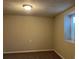 Neutral-toned bedroom with a carpeted floor, small window, and a standard ceiling light at 405 Dogwood Ave, Brighton, CO 80601