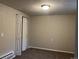Neutral-toned bedroom with a carpeted floor, closet, and a standard ceiling light at 405 Dogwood Ave, Brighton, CO 80601