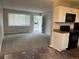 Open-concept kitchen and living room, flooded with natural light, provides a welcoming and functional space for daily living at 405 Dogwood Ave, Brighton, CO 80601