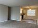 Living room showcasing seamlessly connected spaces with mixed flooring and an inviting atmosphere at 405 Dogwood Ave, Brighton, CO 80601