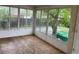 Sun room with backyard view and wood flooring at 405 Dogwood Ave, Brighton, CO 80601