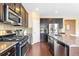 Updated kitchen with granite counters, a gas range, and stainless steel appliances at 2897 Hillcroft Ln, Castle Rock, CO 80104