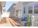 Inviting back patio with outdoor seating and sliding glass doors for seamless indoor-outdoor living at 11905 Quitman St, Westminster, CO 80031