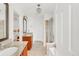 Bright bathroom features double vanities, granite countertops, neutral tile, walk-in shower, and a chandelier at 11905 Quitman St, Westminster, CO 80031