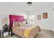 Bedroom featuring a bed with colorful bedding, soft carpet, and natural light at 11905 Quitman St, Westminster, CO 80031