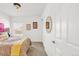 Bright bedroom with stylish bedding, and a round mirror at 11905 Quitman St, Westminster, CO 80031