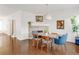 Inviting dining area with hardwood floors, stylish decor, and a cozy fireplace at 11905 Quitman St, Westminster, CO 80031