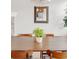 Close up of a modern dining area featuring a wooden table, chairs, and contemporary decor at 11905 Quitman St, Westminster, CO 80031