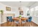 Elegant dining room featuring a fireplace, modern chandelier, and seating for six guests at 11905 Quitman St, Westminster, CO 80031