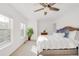 Cozy main bedroom featuring a comfortable bed and bright natural light at 11905 Quitman St, Westminster, CO 80031