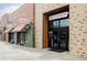 A modern brick storefront for Pure Barre, with glass doors and clear signage at 11905 Quitman St, Westminster, CO 80031