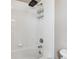 Modern bathroom features a bathtub, shower, and all-white tile at 3812 Red Deer Trl # D, Broomfield, CO 80020