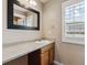 Bathroom vanity features wood cabinets and a white sink at 3812 Red Deer Trl # D, Broomfield, CO 80020