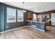 Open concept kitchen with natural wood cabinets, a spacious island, and stainless steel appliances at 3812 Red Deer Trl # D, Broomfield, CO 80020