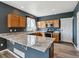 Modern kitchen with wooden cabinets, stainless steel appliances and light granite counters at 3812 Red Deer Trl # D, Broomfield, CO 80020