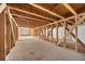 Unfinished basement, ready for customization, featuring exposed beams and ample space at 4625 W 50Th Ave # 110, Denver, CO 80212