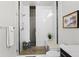 Contemporary bathroom featuring a glass shower with a built-in bench and modern fixtures at 4625 W 50Th Ave # 110, Denver, CO 80212