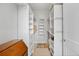 Walk-in closet with custom shelving and drawers, maximizes storage space at 4625 W 50Th Ave # 110, Denver, CO 80212