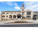 Stunning condo exterior featuring a unique tower, beautiful architecture and well-maintained landscaping at 4625 W 50Th Ave # 110, Denver, CO 80212