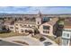 Aerial view of community featuring unique architecture, parking and mountain view at 4625 W 50Th Ave # 110, Denver, CO 80212