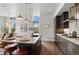 Bright kitchen with an island featuring bar stool seating and dark wood cabinetry at 4625 W 50Th Ave # 110, Denver, CO 80212