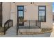 Covered front porch with black railing and room for seating at 4625 W 50Th Ave # 110, Denver, CO 80212