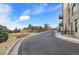 View of street next to property featuring well manicured lawn and mature trees at 4625 W 50Th Ave # 110, Denver, CO 80212