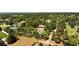 Aerial view of house, pool, and expansive grounds at 6200 Charrington Dr, Cherry Hills Village, CO 80111