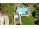 Luxury pool with large deck and multiple umbrellas at 6200 Charrington Dr, Cherry Hills Village, CO 80111