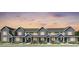 Charming row of two-story townhomes featuring modern architecture and inviting entrances at 17125 W 91St Ln, Arvada, CO 80007