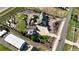 Large landscaped lot featuring a custom home, detached garage and various outbuildings at 15280 Bannock St, Broomfield, CO 80023