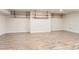 Unfinished basement with wood floors and shelves ready to be transformed at 15280 Bannock St, Broomfield, CO 80023