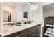 Bathroom featuring dual sinks, granite countertops, and modern fixtures at 15280 Bannock St, Broomfield, CO 80023