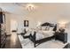 Bedroom with hardwood floors, a large rug, neutral colors, and modern decor at 15280 Bannock St, Broomfield, CO 80023
