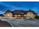 Stone-clad home featuring a welcoming front porch, accented with black trim and a charming facade for inviting curb appeal at 15280 Bannock St, Broomfield, CO 80023