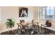 Bright home office space featuring wood desk and a black and white horse portrait at 15280 Bannock St, Broomfield, CO 80023