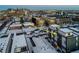 An aerial view of a modern home showcases its urban location near the city skyline at 1933 Grove St, Denver, CO 80204