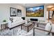 Modern living room showcasing comfortable seating, stylish decor, and a large screen for entertainment at 1933 Grove St, Denver, CO 80204