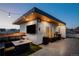 Inviting rooftop deck with string lights, outdoor furniture, and a sleek wooden ceiling at 1933 Grove St, Denver, CO 80204