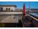 Relaxing rooftop deck with an umbrella, comfortable seating, and city views at 1933 Grove St, Denver, CO 80204