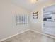 Dining area with tile floors, natural light from a window, and adjacent kitchen at 3353 S Glencoe St, Denver, CO 80222
