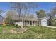Front exterior of a single-story home with a lawn, large tree and one car garage at 3353 S Glencoe St, Denver, CO 80222