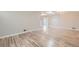 Bright living room featuring hardwood floors, a skylight, and contemporary lighting at 3353 S Glencoe St, Denver, CO 80222