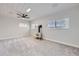 Cozy room with a rustic stove, carpet flooring, and wood plank ceiling with recessed lighting at 3353 S Glencoe St, Denver, CO 80222